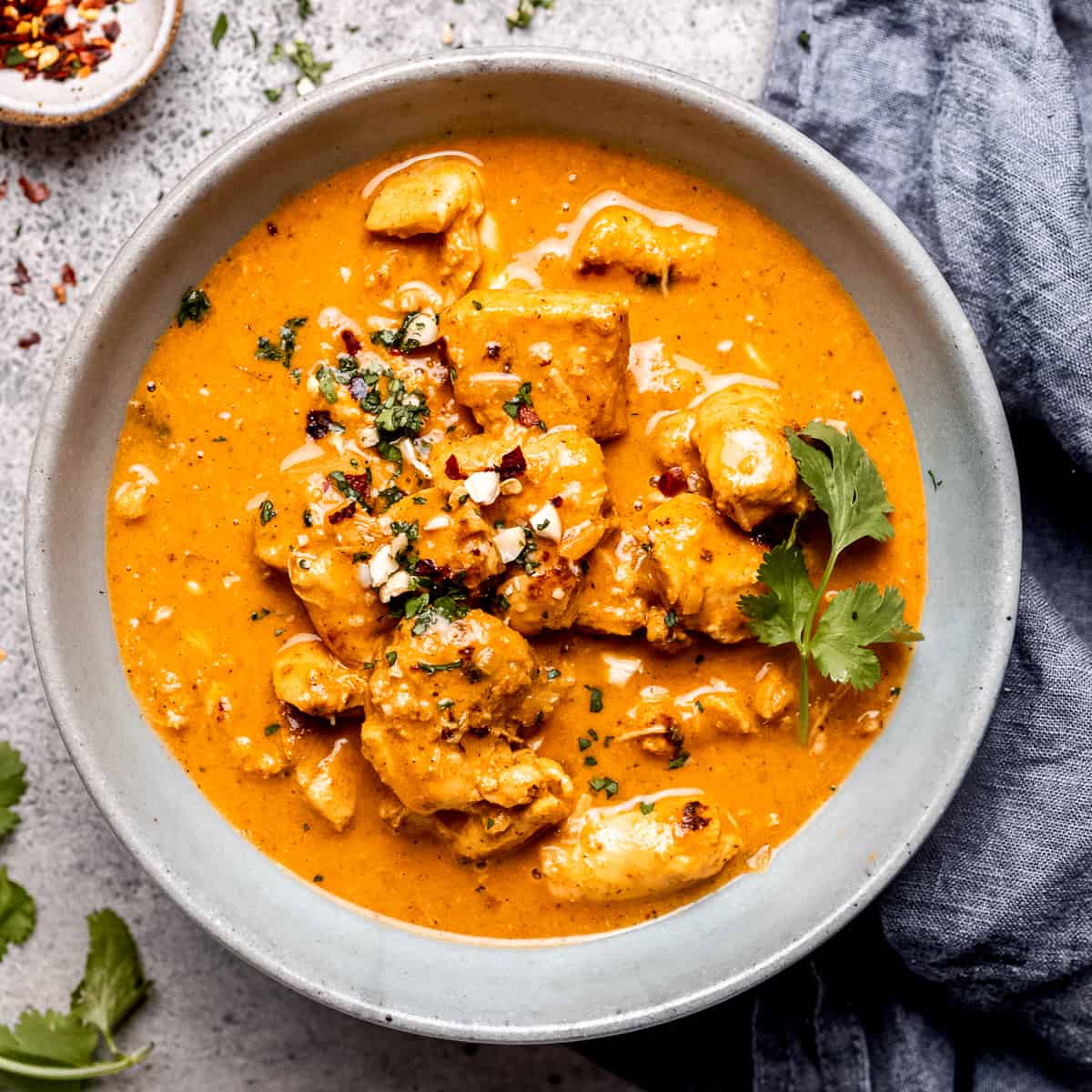 Slow cooked chicken Korma with cilantro.