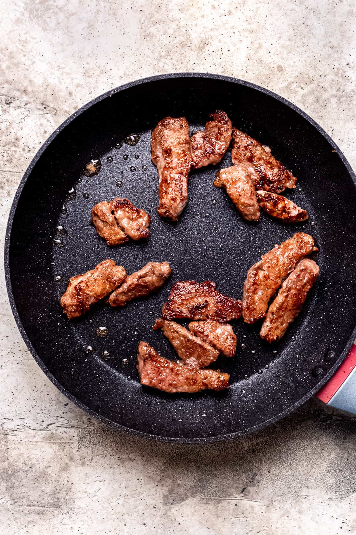 Crispy beef in a skillet.