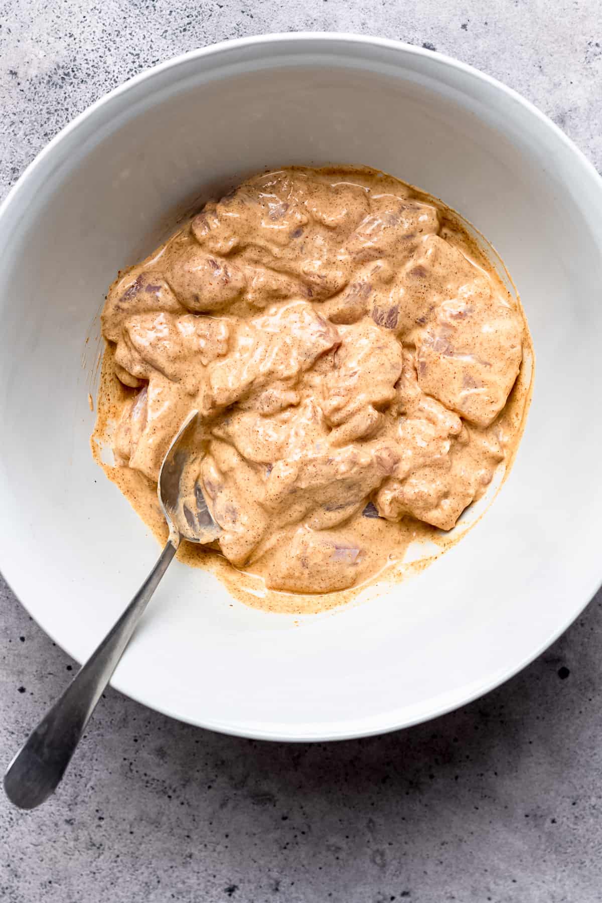 Chicken in spiced yogurt for curry.