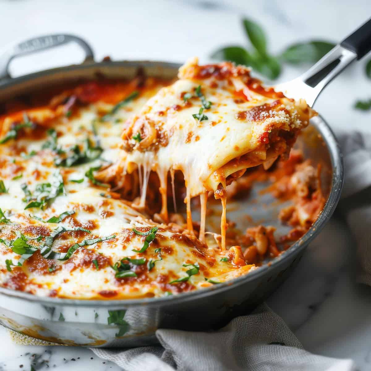 One pan lasagna with basil and mozzarella.