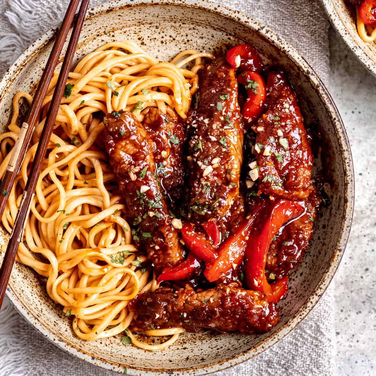 Shredded crispy chilli beef with noodles.