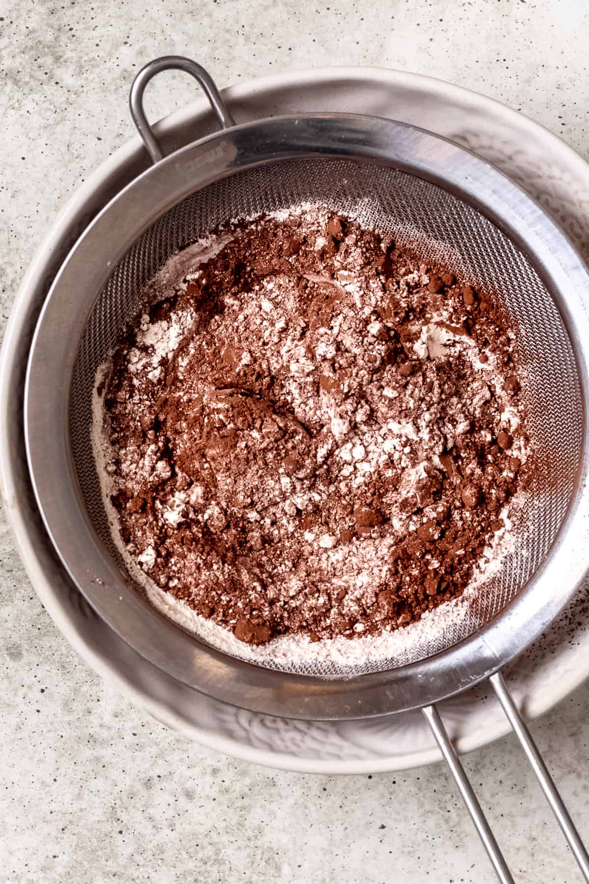 Sifted cocoa powder and flour in a bowl.