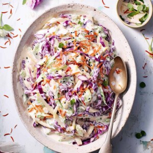 Jamie Oliver's coleslaw on a white plate.