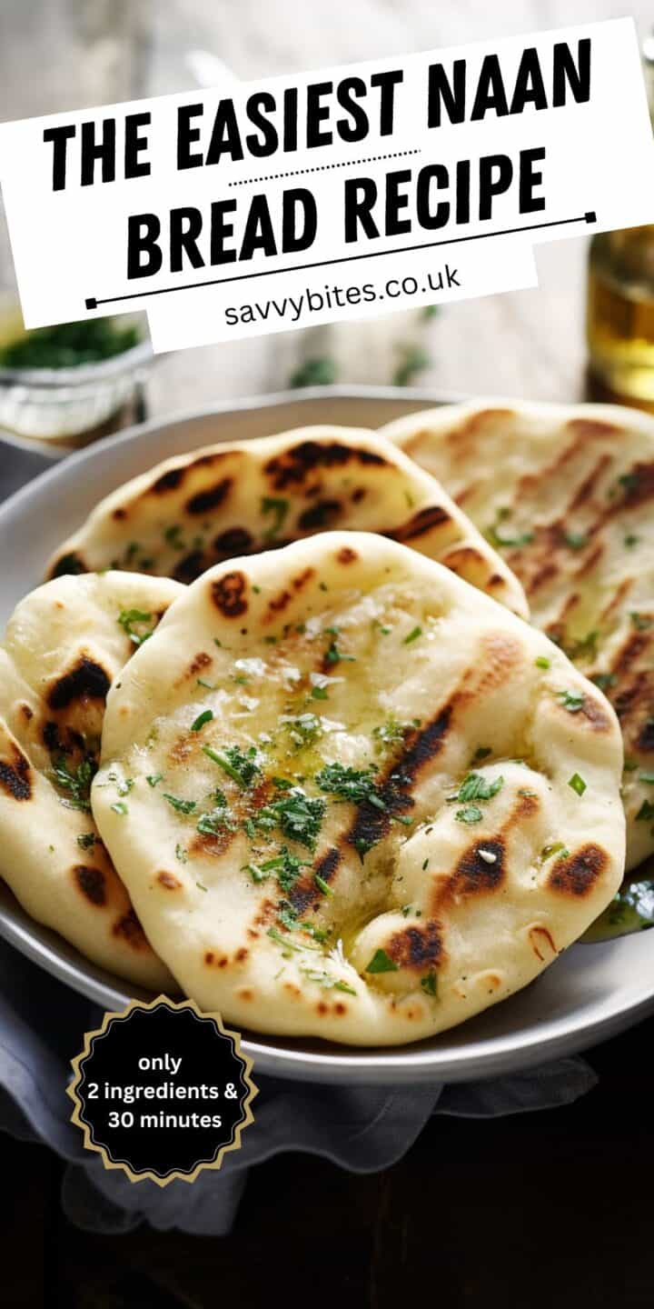 Fluffy naan bread on a plate with herb butter.