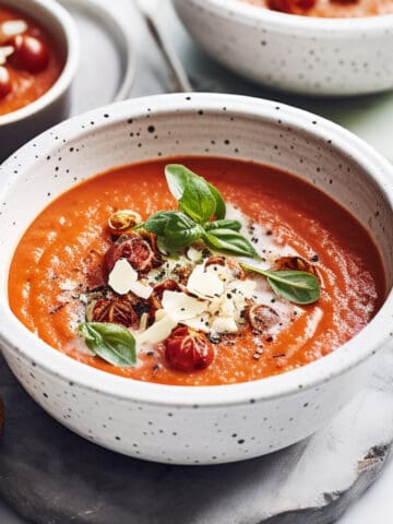 Roasted tomato soup with parmesan cheese and basil.