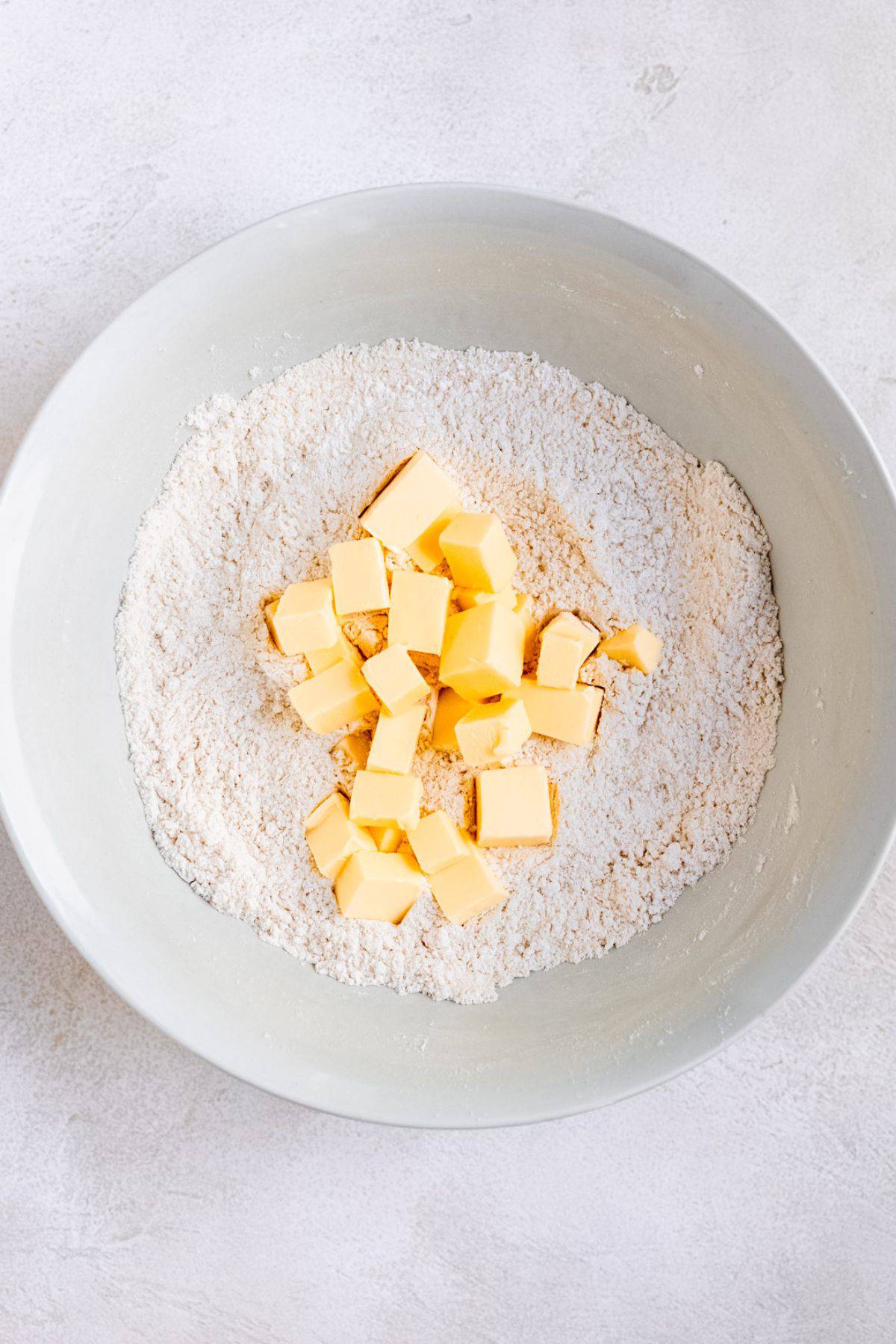 Butter being rubbed into flour.