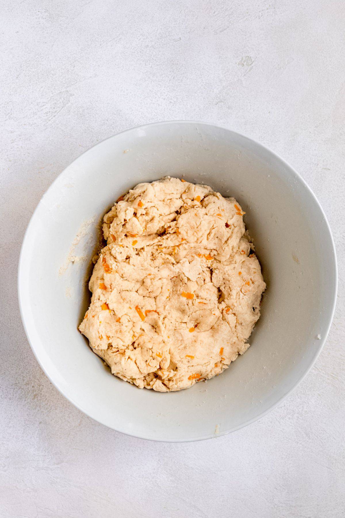 Cheese scone dough in a mixing bowl.