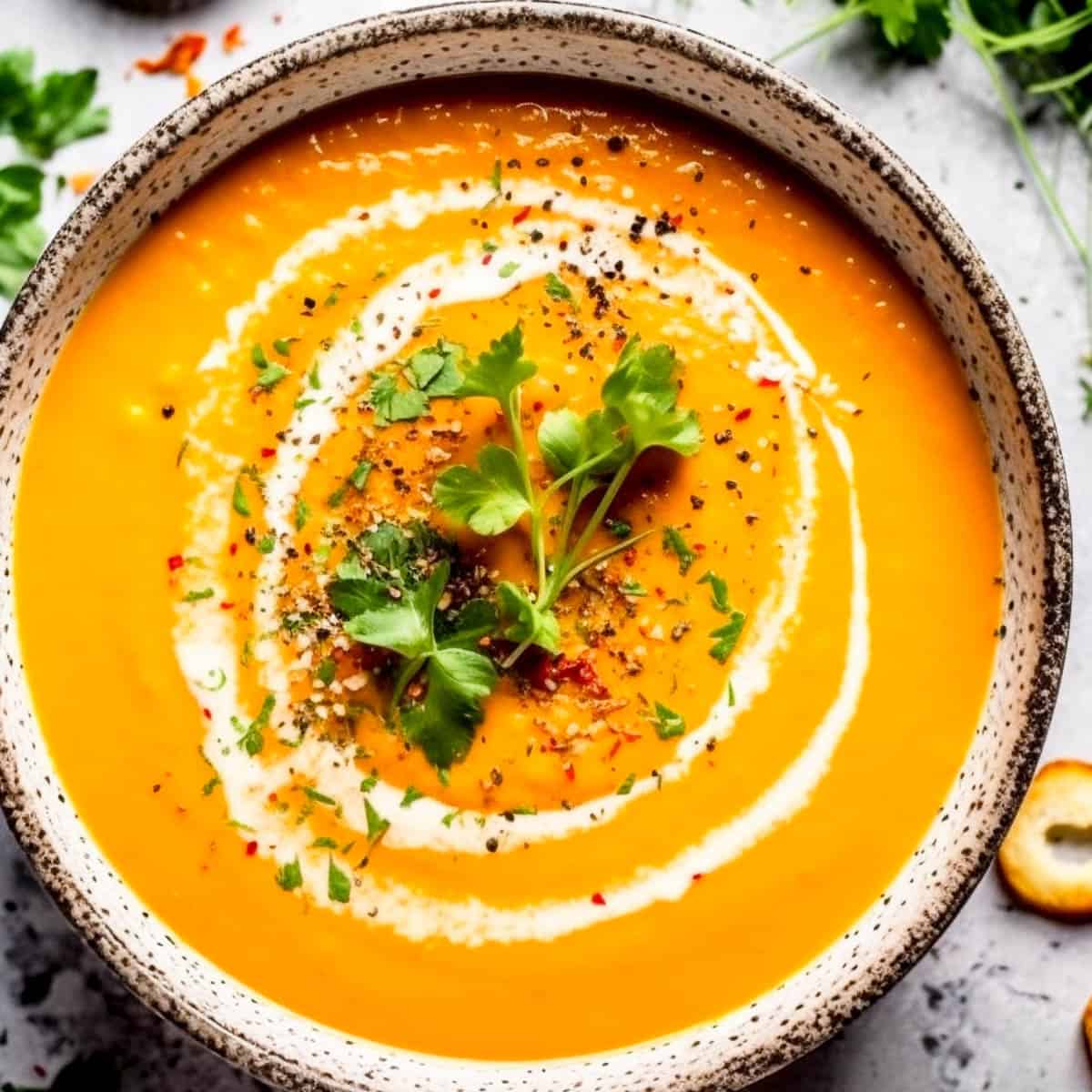 Carrot and coriander soup in a bowl.