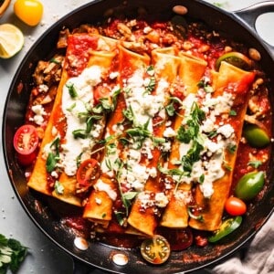 Easy vegetarian enchilada recipes with cheese in a skillet.