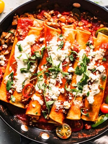 Easy vegetarian enchilada recipes with cheese in a skillet.