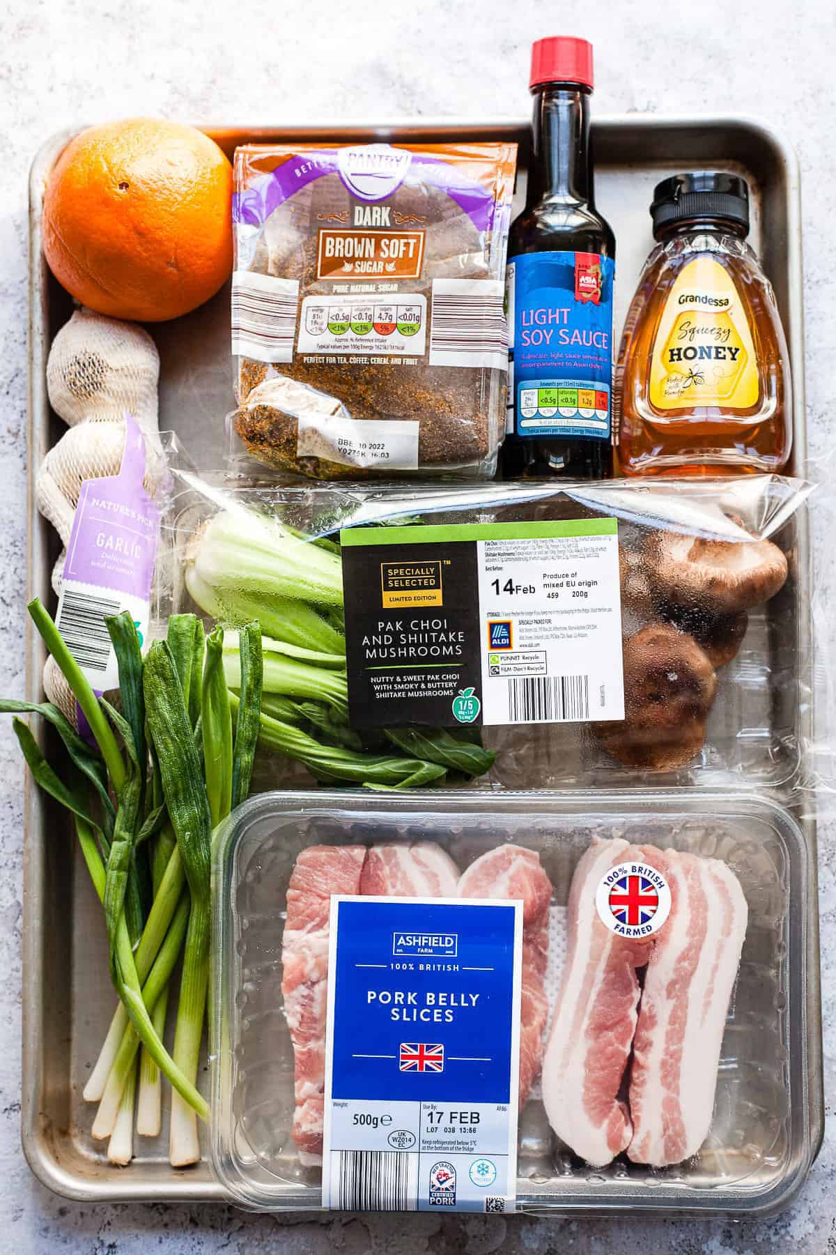 Ingredients for Asian-style roasted pork belly on a tray.