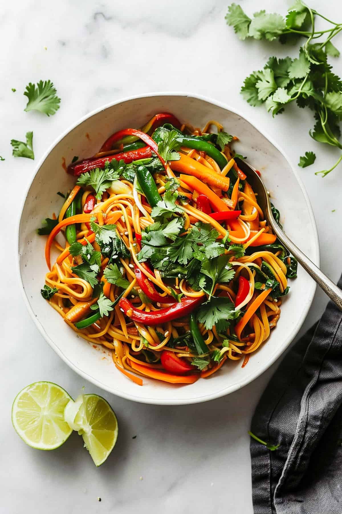15 Minute vegetable noodle stir fry in a white bowl.