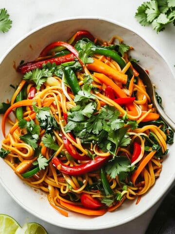 15 Minute vegetable noodle stir fry in a white bowl.