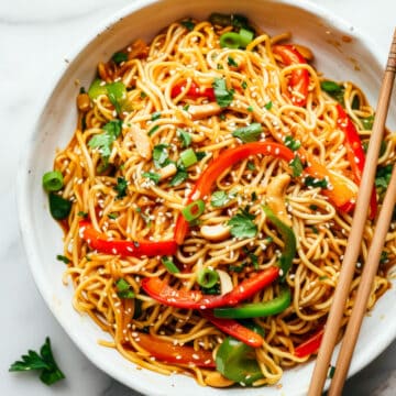 Easy 15-minute Asian-style noodles with vegetables in a white bowl.