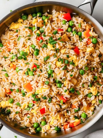 Easy egg-fried rice with vegetables in a skillet.