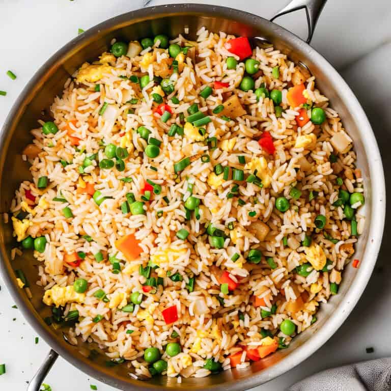 Easy egg-fried rice with vegetables in a skillet.