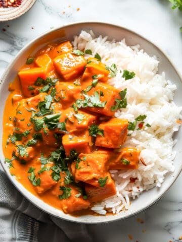Easy sweet potato curry with rice and coriander in a bowl.