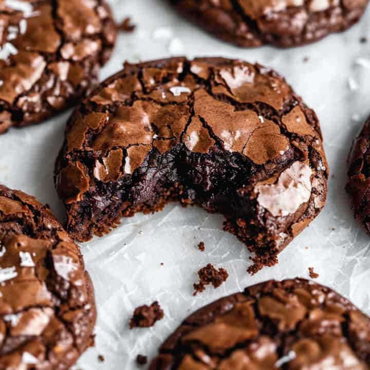 Soft and chewy brookies (brownie cookies) on a piece of parchment paper.