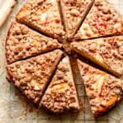 Apple crumble cake on a piece of baking paper.