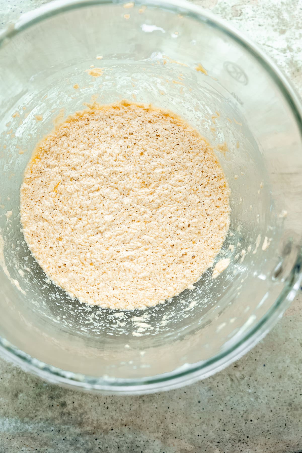 Eggs added to the butter and sugar apple cake batter.
