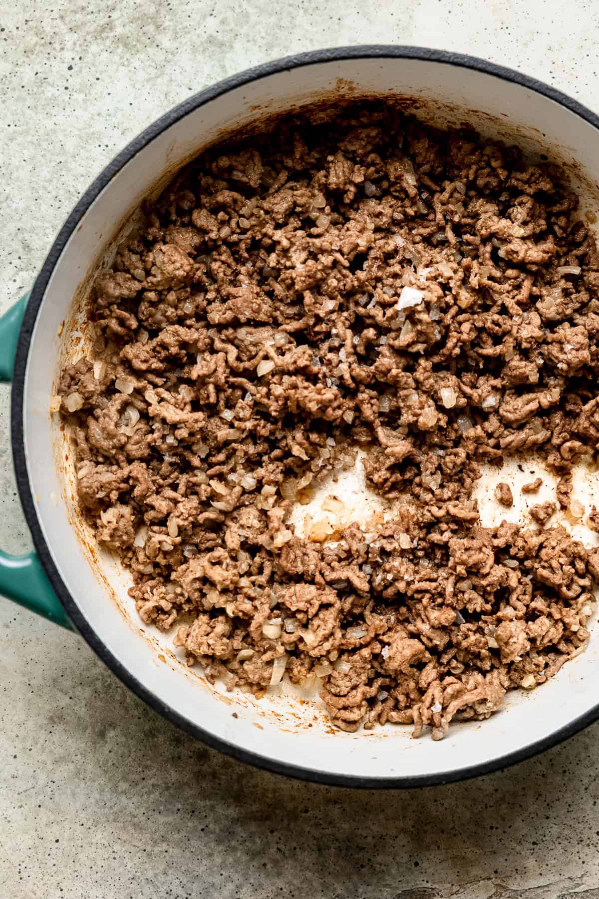 Ground beef mince being browned for bolognese sauce.