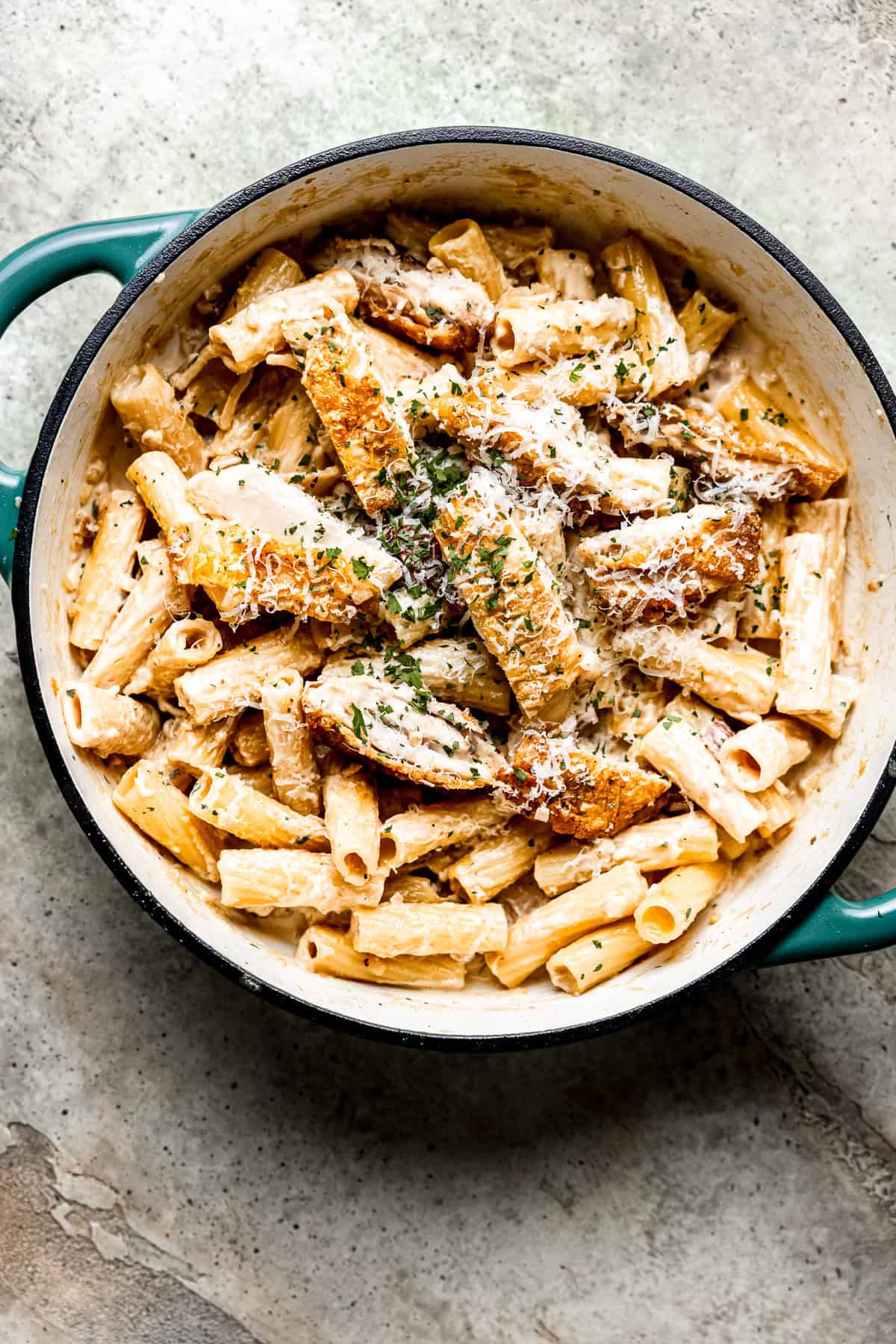 Creamy chicken bacon pasta in a skillet.