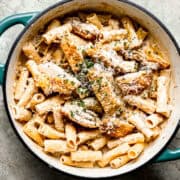 Creamy chicken bacon pasta in a skillet.
