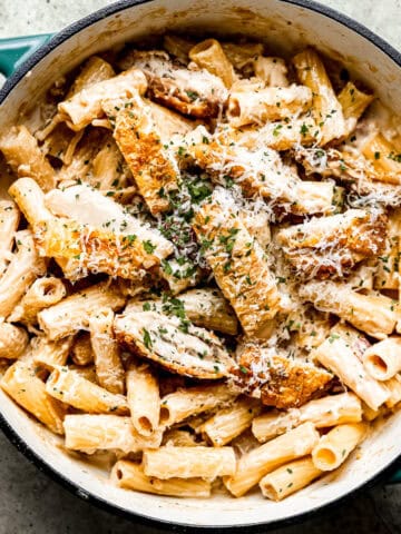 Creamy chicken bacon pasta in a skillet.