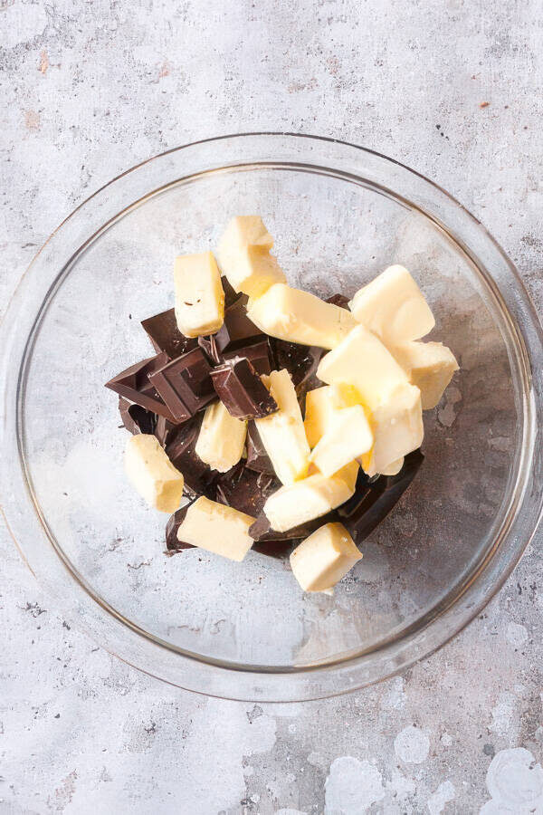 Chocolate and butter in a bowl for melting to make chocolate biscuits.