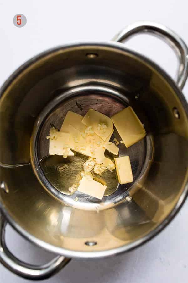 honey garlic butter sauce for baked salmon in a pan